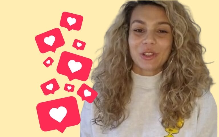 Smiling woman with long curly hair in a light jumper beside floating red chat bubbles with white heart icons on a pale yellow background.