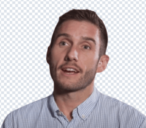Head-and-shoulders photo of a man with short brown hair and stubble wearing a light blue checked shirt, mouth open as if speaking, on a transparent background.